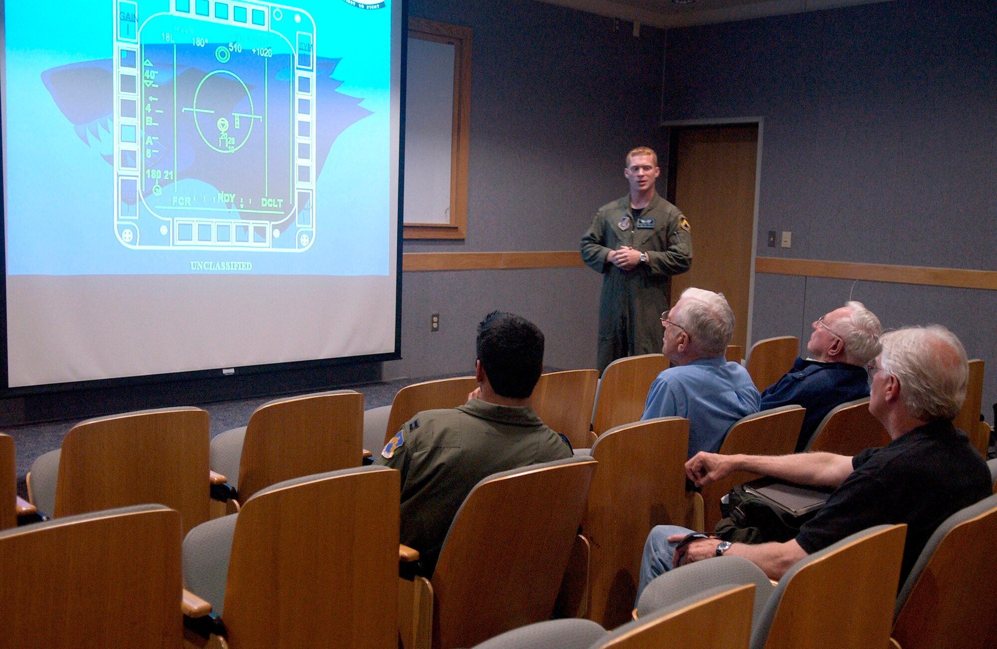 Capt. Pat Kennedy briefs four visiting Korean War veterans Sept. 11 on flying sortie operations at Kunsan Air Base, South Korea.  The veterans were visiting Kunsan and sharing their flying experiences with 8th Fighter Wing Airmen.  Captain Kennedy is with the 35th Fighter Squadron.  (U.S. Air Force photo/Senior Airman Giang Nguyen)