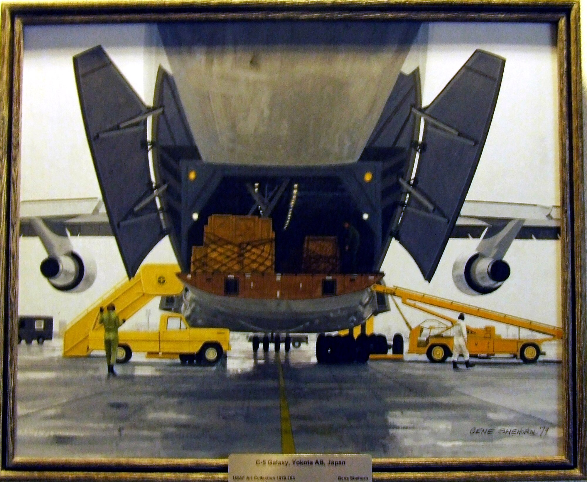 This 1979 painting by artist Gene Shehorn, entitled "C-5 Galaxy, Yokota Air Base, Japan," is one of numerous pieces from the Air Force Art Program on display in the Air Force Expeditionary Center on Fort Dix, N.J.  (U.S. Air Force Photo by Tech. Sgt. Scott T. Sturkol)
