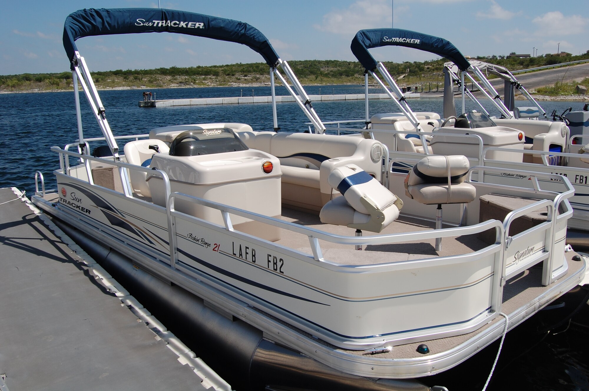 LAUGHLIN AIR FORCE BASE, Texas – New boats recently added to the rental lineup at Laughlin’s Southwinds Marina, located on Lake Amistad, include three ski boats, two fishing boats, and two pontoon boats.  The ski and pontoon boats feature sun shades, more convenient seating, and are equipped with a CD and FM/AM stereo system.  Future additions to the pontoon boats, including fish finders and trolling motors, will make them ideal for fishing groups of up to eight people.  All of the new boats are available for rental, and can be reserved after completing the boating safety course at the Southwinds Marina.  The marina also offers various other skiing and fishing rental equipment.  (U.S. Air Force Photo/2nd Lt. Wesley Holdman)