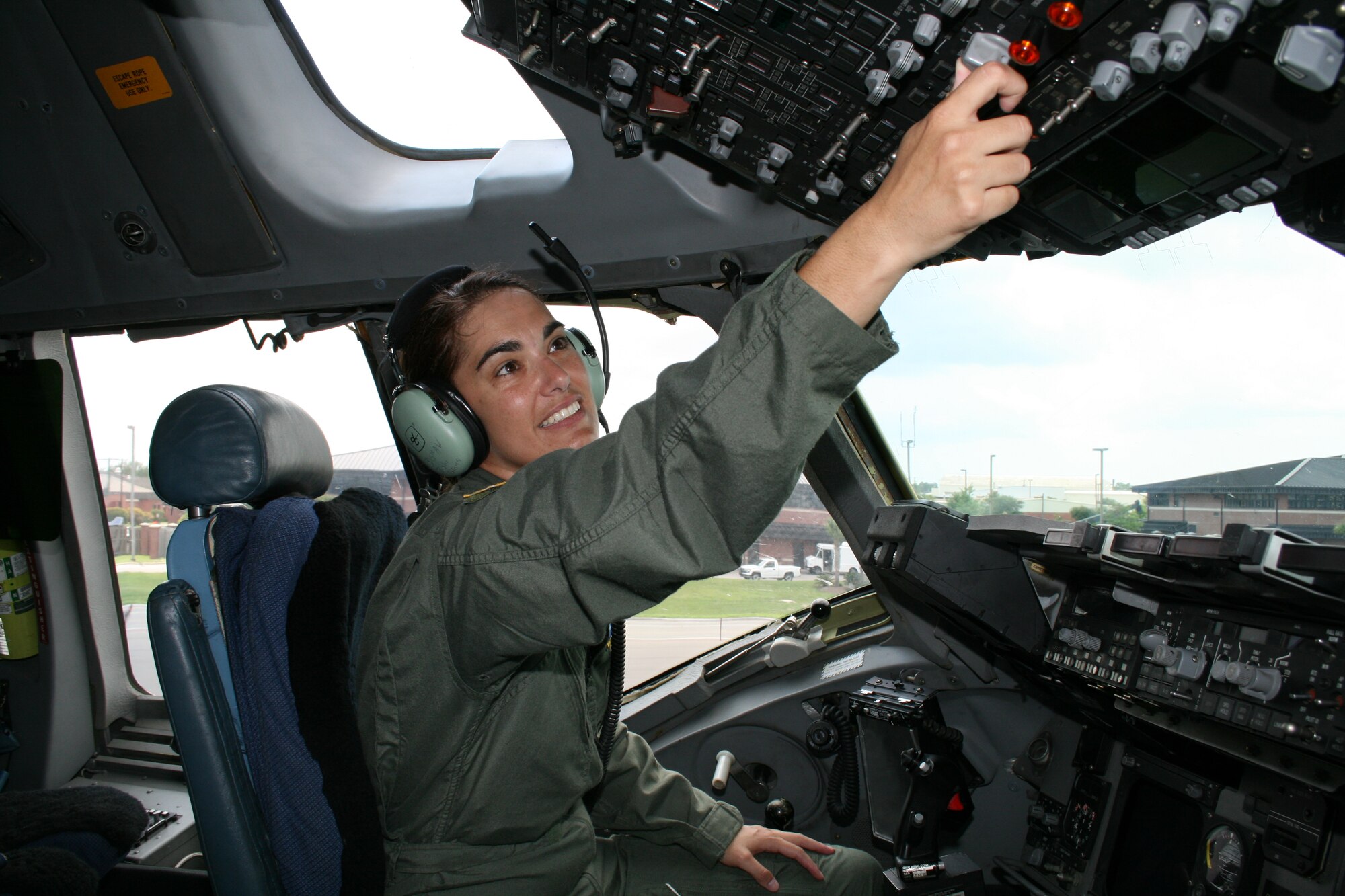 Capt. Elizabeth Dietrich, 300 Airlift Squadron, Charleston Air Force, S.C., performs preflight inspection on a C-17 Globemaster III. (photo by Tony Clark)