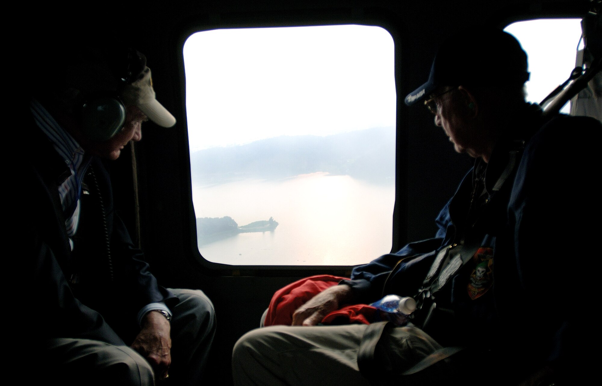 Korean War veterans Col. Buzz Aldrin (left) and Lt. Col. Harold Fischer take an aerial look over South Korea while flying in a helicopter during a Sept. 11 tour of Osan Air Base, South Korea. Colonel Aldrine served as lunar module pilot for Apollo 11 July 16 through 24, 1969, the first manned lunar landing mission. Colonel Fischer is a Korean War double ace. The Korean War veterans are visiting South Korea during a week-long tour in observance of the Air Force's 60th Anniversary. (U.S. Air Force photo/Staff Sgt. Bennie J. Davis III)