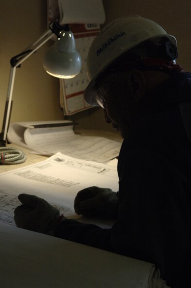 Civilian contractor Sheldon Ribsman identifies circuit locations in April during the renovation period of one of the buildings that will house the Air Force Financial Services Center at Ellsworth Air Force Base, S.D. The AFFSC will consolidate financial services from 93 bases into a single location, employing up to 775 people making Ellsworth the financial hub of the Air Force. (U. S. Air Force photo/Staff Sgt. Michael B. Keller) 
