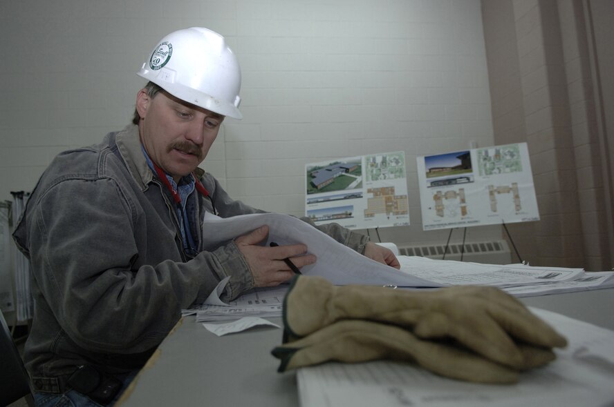 Civilian contractor Ron Crecelius reviews the Air Force Financial Services Center site layout plan in April as changes begin to accommodate the new mission and manning at Ellsworth Air Force Base, S.D. The center will consolidate financial services from 93 bases into a single location, employing up to 775 civilian and military personnel making AFFSC at Ellsworth the financial hub of the Air Force. (U. S. Air Force photo/Staff Sgt. Michael B. Keller)