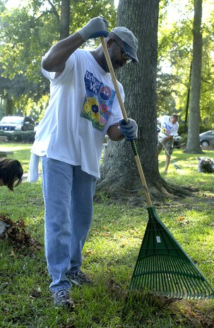 Master Sgt. Mike Wooden, 437th Comptroller Squadron, rakes leaves at Quaterman Park in North Charleston as part of the Trident United Way's "Day of Caring" Tuesday. (U.S. Air Force Photo/Tech. Sgt. Paul Kilgallon)                                