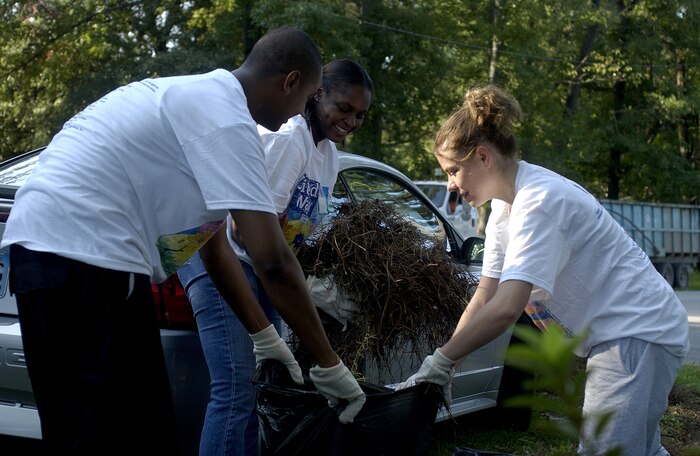 Senior Airman Bescerat Belai, Staff Sgt. Faustina Lang and Airman Brittney Knowling, all from the 437th Comptroller Squadron collect leaves and old ground covering at Quaterman Park in North Charleston as part of the Trident United Way's "Day of Caring" Tuesday. More than 100 Airmen from Charleston AFB participated  at several locations throughout the Greater Charleston area. (U.S. Air Force Photo/Tech. Sgt. Paul Kilgallon)                          
