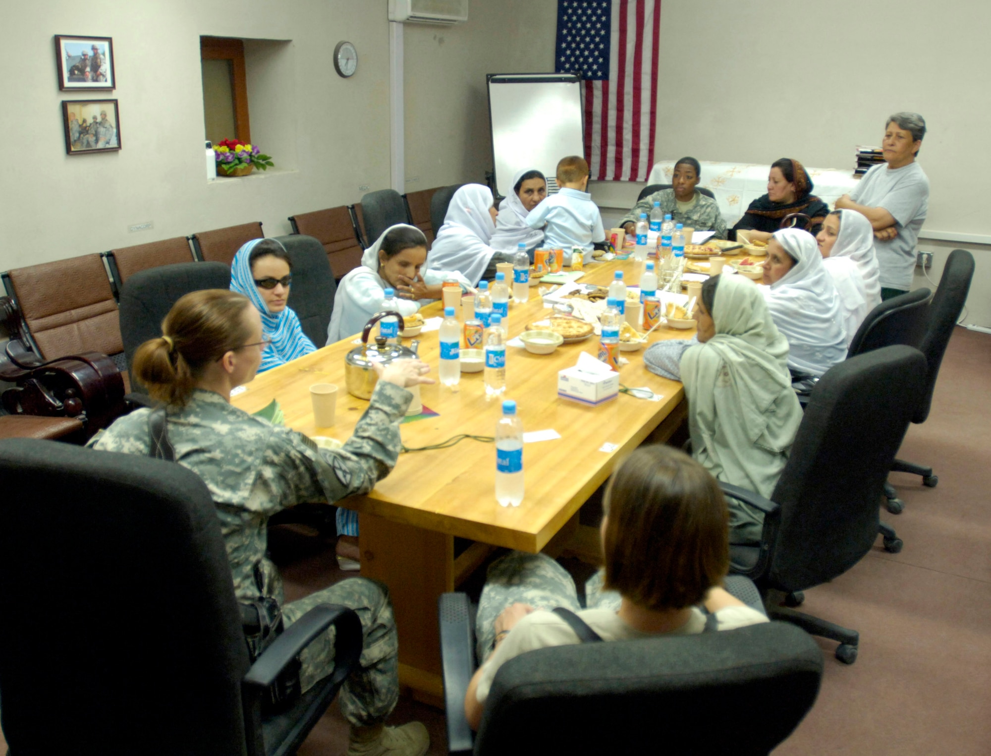 U.S. female Airmen and Soldiers assigned to the Laghman Provincial Reconstruction Team host an afternoon tea Sept. 5 at Forward Operating Base Mehtar Lam for influential Afghan women living throughout Afghanistan's Laghman province. The tea provides an opportunity to educate the Afghan women on various humanitarian and security programs in place for them and their communities. (U.S. Air Force photo/Staff Sgt. Julie Weckerlein)