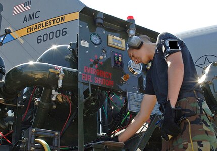 Airman 1st Class Andrew Maule, 437th Logistics Readiness Squadron fuels operator, performs a 120 K defuel of a C-17 operation Monday. An aircraft must be defueled as a maintance check for possible fuel contamination. (U.S. Air Force Photo/Airman 1st Class Cynthia Spalding) 