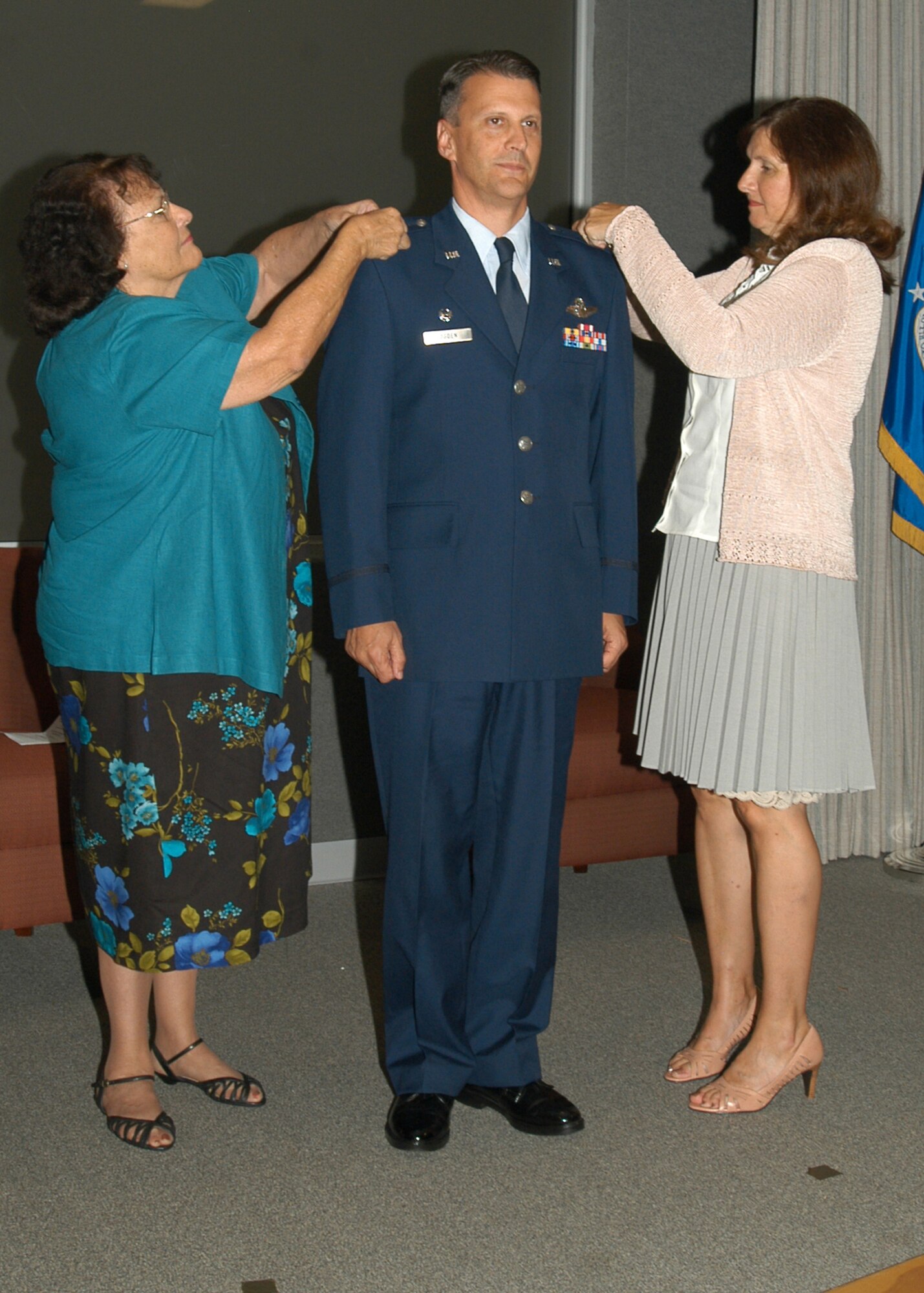 GRISSOM AIR RESERVE BASE, Ind., -- Randall Ogden, 434th Operations Group commander, has his new eagle insignias pinned on during his promotion ceremony.  In addition to being promoted, Colonel Ogden also assumed command of the 434th OG. (U.S. Air Force photo/Senior Airman Ben Mota)
