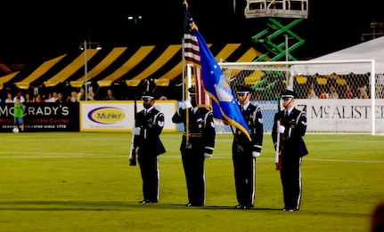 Tech. Sgt. Darryl Allen, 315th Aeromedical-dental Squadron, and Tech. Sgt. Robert Porter, Staff Sgt. David Collins and Senior Airman Myles Alexander, all from the 315th Aircraft Maintenance Squadron, present the colors as members of the Team Charleston Honor Guard for the last Charleston Battery Soccer game of the season  at the Charleston Battery Soccer Field Sept. 7.  (U.S. Air Force photo/Airman 1st Class Nicholas Pilch) 