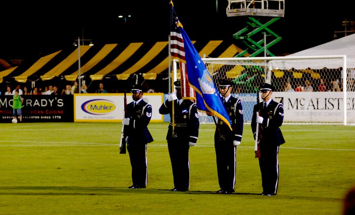 Tech. Sgt. Darryl Allen, 315th Aeromedical-dental Squadron, and Tech. Sgt. Robert Porter, Staff Sgt. David Collins and Senior Airman Myles Alexander, all from the 315th Aircraft Maintenance Squadron, present the colors as members of the Team Charleston Honor Guard for the last Charleston Battery Soccer game of the season  at the Charleston Battery Soccer Field Sept. 7.  (U.S. Air Force photo/Airman 1st Class Nicholas Pilch) 