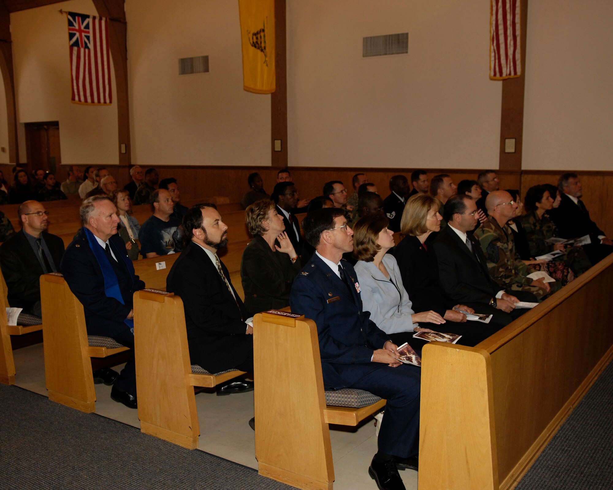 VANDENBERG AIR FORCE BASE, Calif. -- Guests in attendance of the Sept. 11 Remembrance event view a slideshow at Chapel One of images the Sept. 11 attacks.  Vandenberg's Remembrance Day event was to honor fallen Americans and to remember how the national course of history was changed by the events of Sept. 11, 2001.  (U.S. Air Force photo/Airman 1st Class Bryan Boyette)



