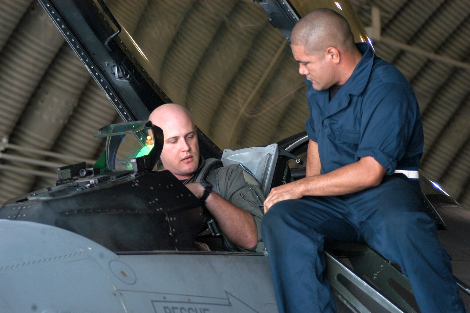 Capt. Dave Anderson and Staff Sgt. Tim Silva do a pre-flight inspection Sept 10 at Kunsan Air Base, South Korea. Captain Anderson recently received the Distinguished flying cross for his actions in support of Operation Iraqi Freedom. Captain Anderson is a flight commander for the 35th Fighter Squadron and Sergeant Silva is a crew chief for the 35th Aircraft Maintenance Unit. (U.S. Air Force photo/Staff Sgt. Araceli Alarcon)                                
