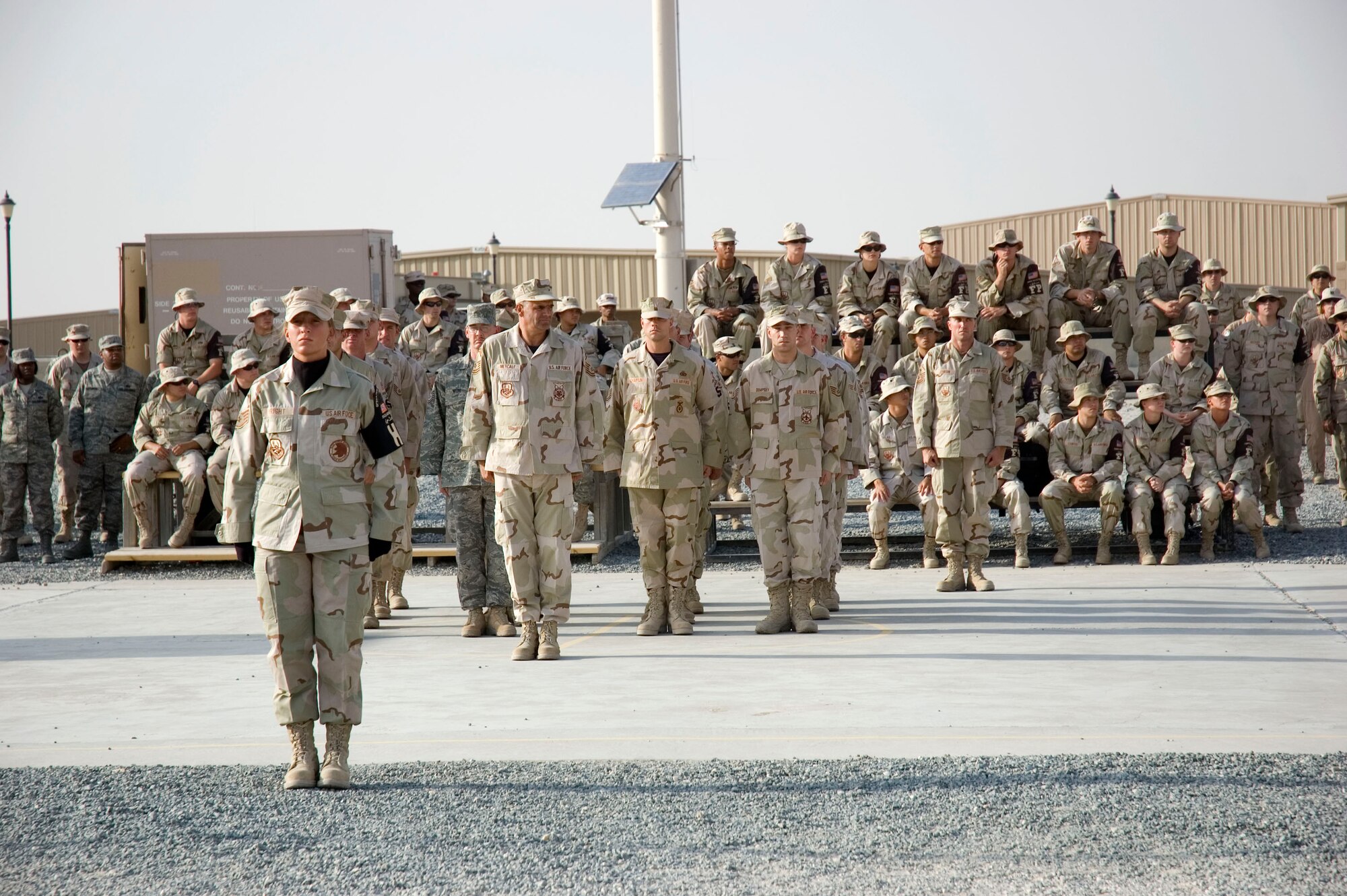 Airmen from the 386th Air Expeditionary Wing pay tribute to the men and women who lost their lives during the Sept. 11, 2001, remembrance ceremony Sept. 11 at an undisclosed location in S.W. Asia. The ceremony marked the sixth anniversary of the terrorist attacks in New York City, the Pentagon and Shanksville, Pa. (U.S. Air Force photo illustration by SSgt Tia Schroeder)