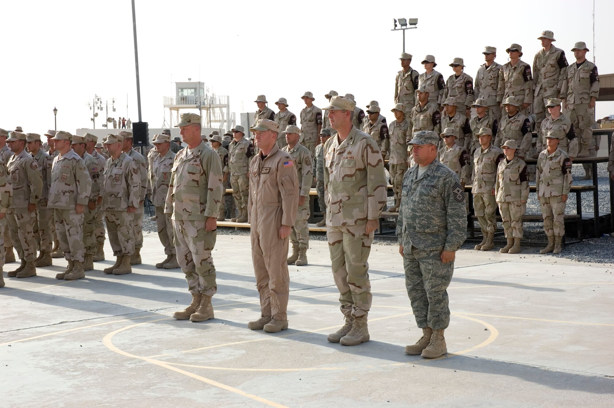 Airmen from the 386th Air Expeditionary Wing pay tribute to the men and women who lost their lives during the Sept. 11, 2001, remembrance ceremony Sept. 11 at an undisclosed location in S.W. Asia. The ceremony marked the sixth anniversary of the terrorist attacks in New York City, the Pentagon and Shanksville, Pa. (U.S. Air Force photo illustration by SSgt Tia Schroeder)