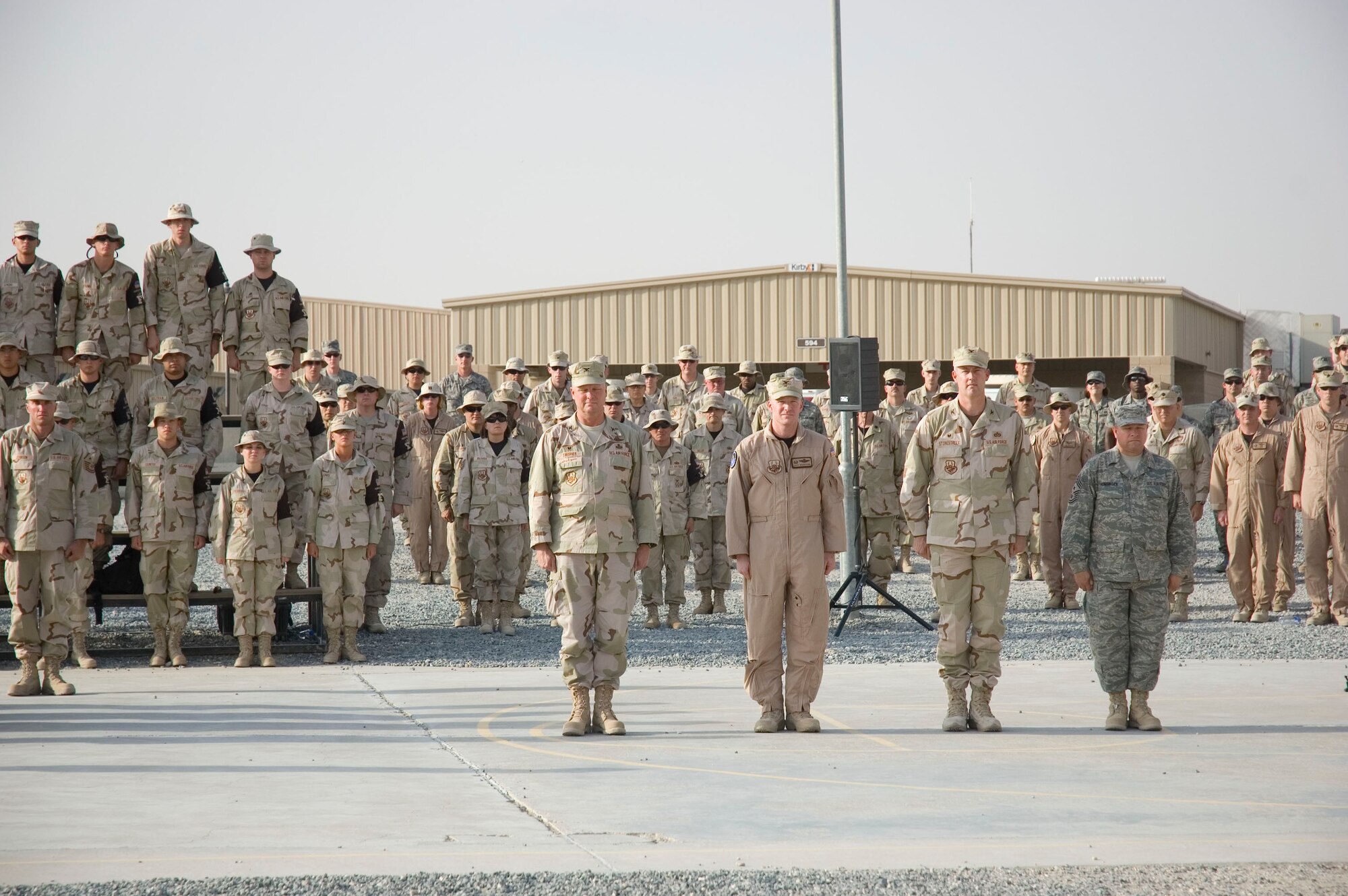 Airmen from the 386th Air Expeditionary Wing pay tribute to the men and women who lost their lives during the Sept. 11, 2001, remembrance ceremony Sept. 11 at an undisclosed location in S.W. Asia. The ceremony marked the sixth anniversary of the terrorist attacks in New York City, the Pentagon and Shanksville, Pa. (U.S. Air Force photo illustration by SSgt Tia Schroeder)