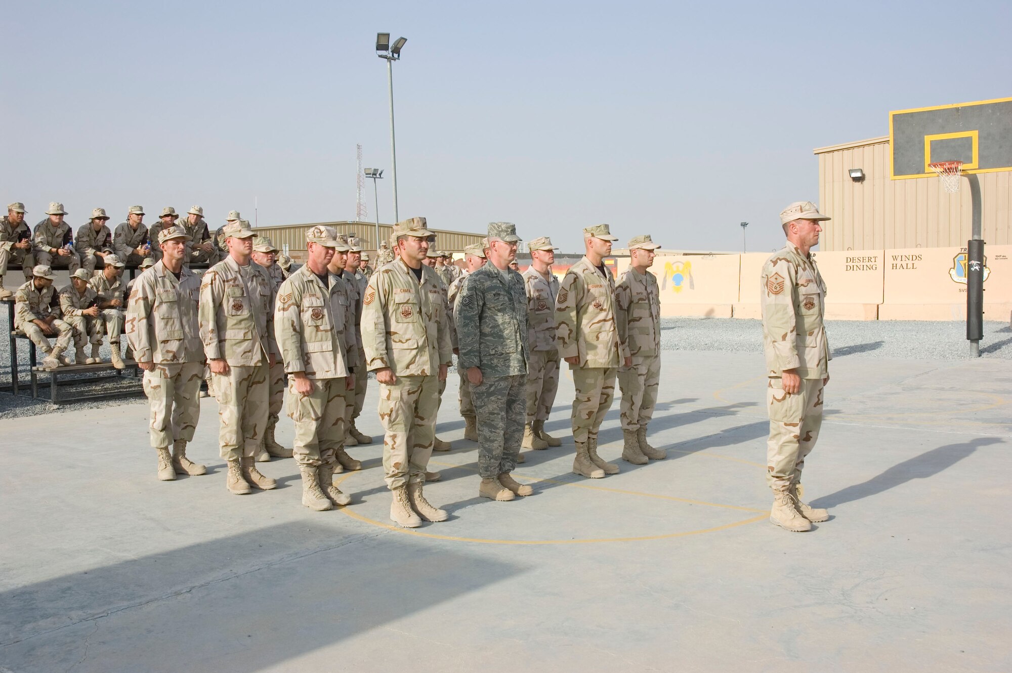 Airmen from the 386th Air Expeditionary Wing pay tribute to the men and women who lost their lives during the Sept. 11, 2001, remembrance ceremony Sept. 11 at an undisclosed location in S.W. Asia. The ceremony marked the sixth anniversary of the terrorist attacks in New York City, the Pentagon and Shanksville, Pa. (U.S. Air Force photo SSgt Tia Schroeder)