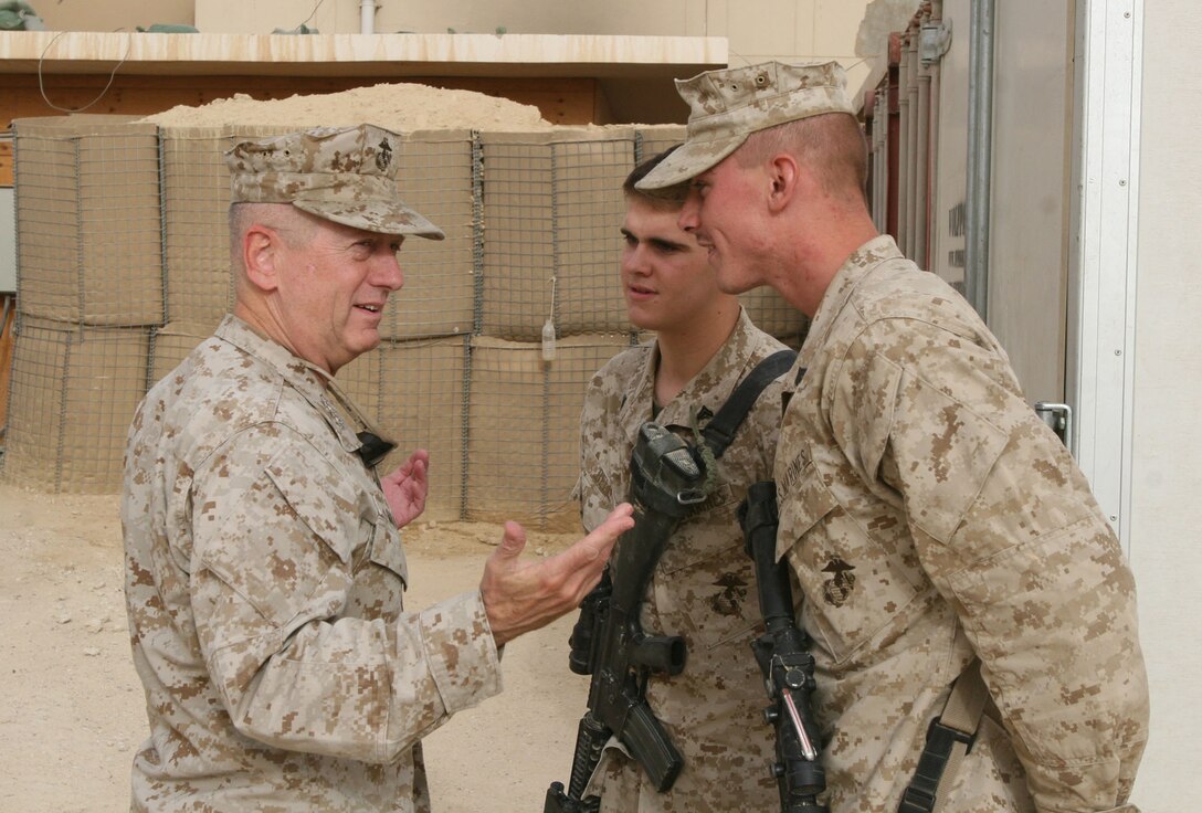 Marine Lt. Gen. James N. Mattis takes a moment to greet Cpls. Brian E. Bell and Gregory L. Souza after arriving at the combat operations point military housing complex in Baghdadi, Iraq, during his late July 2007 visit. Photo by Lance Cpl. Brian L. Lewis, USMC 
