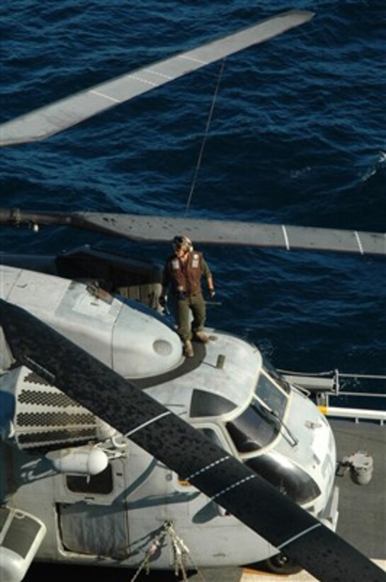 U.S. Marine Corps Sgt. Nathan Deboer, a flight line mechanic attached to Marine Medium Helicopter Squadron 166, inspects the rotor blades of a CH-53E Super Stallion helicopter aboard the USS Tarawa (LHA 1) while under way in the Pacific Ocean on Sept. 8, 2007.  