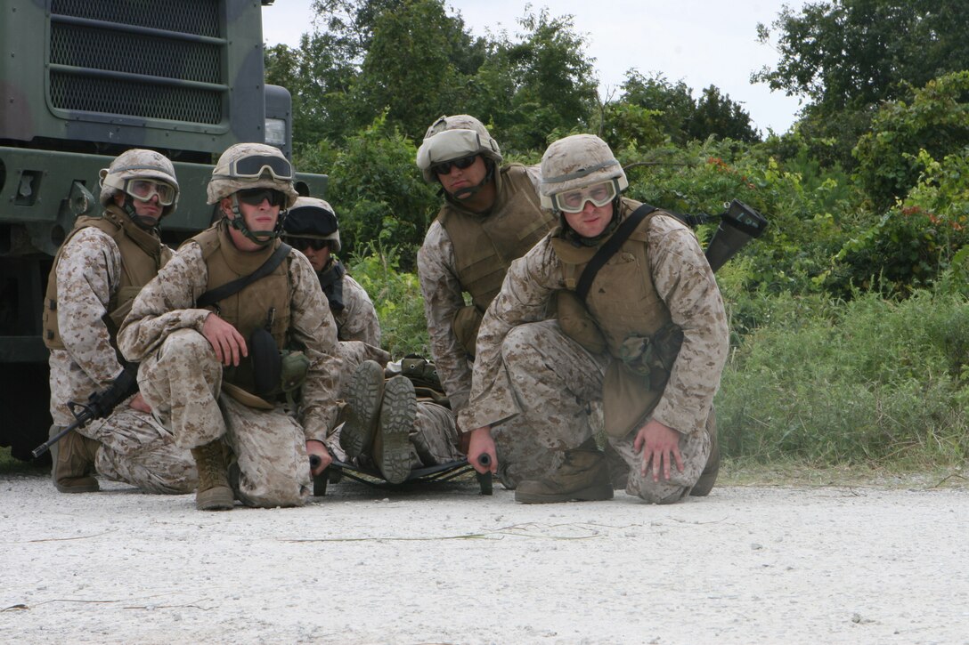 MARINE CORPS BASE CAMP LEJEUNE, N.C. ? Marines from Motor Transport Platoon, Headquarters and Service Company, 2nd Light Armored Reconnaissance Battalion, 2nd Marine Division, prepare to evacuate a simulated wounded Marine aboard an MV-22 Osprey during casualty-evacuation training here Sept. 13. For the Marines of the ?Destroyer? battalion, it was their first chance to train with the newest tool for getting Marines onto and off of the battlefield. With upcoming scheduled deployments in support of Operation Iraqi Freedom, these drills are vital to ensure injured Marines are quickly evacuated in combat.