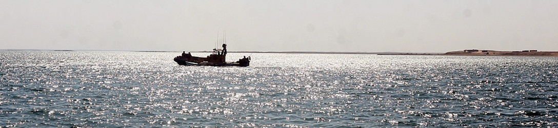 HADITHA DAM, Iraq, (Sept. 16, 2007) – A riverine patrol boat with Detachment 3, Riverine Squadron 1, Riverine Group 1, Navy Expeditionary Combat Command patrols the waters of the Euphrates River. The squadron was stood up, trained, and deployed in less than a year, and is the first Navy riverine unit to be deployed since the Vietnam War. Official Marine Corps Photo By Cpl. Ryan C. Heiser.
