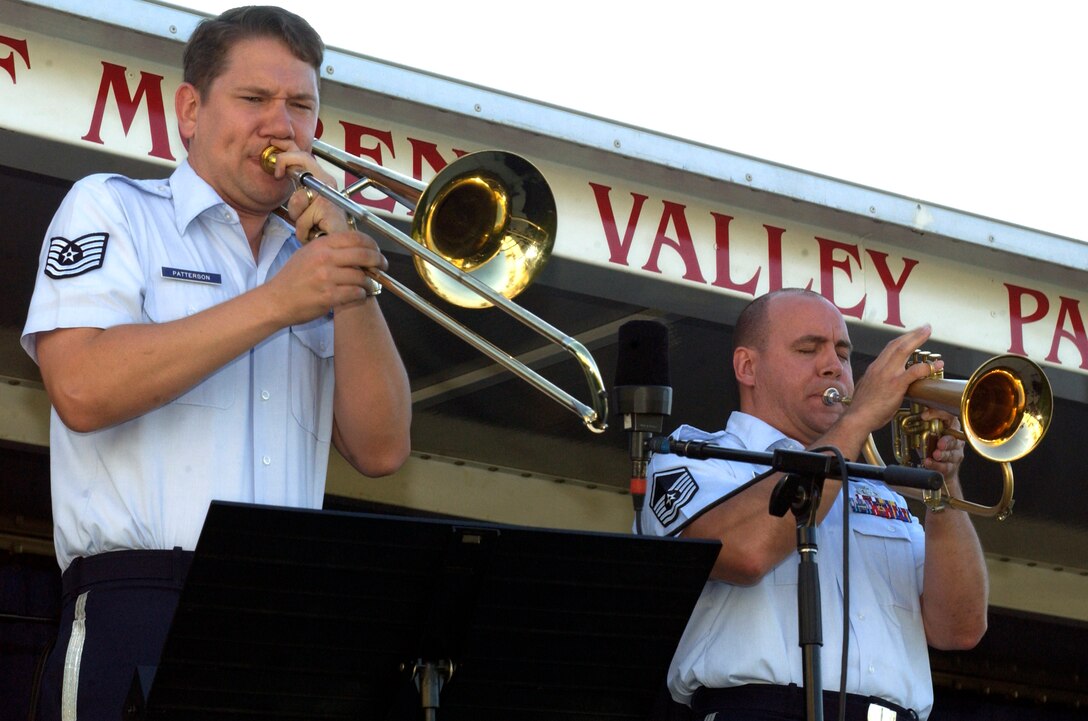 As the sun sank Monday evening the sounds of The United States Air Force Band's Airmen of Note could be heard drifting across the horizon. Over 100 people from March Air Reserve Base and the around the community, including Brig. Gen. James Melin, 452nd Air Mobility Wing commander, gathered on the lawn of the March Field Air Museum in Moreno Valley, Calif., for the sunset performance. The opening song, "No, I don't fly planes," composed by TSgt Ben Patterson, started off the evening's show with a little humor and a lot of talent. The Airmen of Note, created in 1950, is the Air Force's premier jazz ensemble.  They came to the museum to put on a free concert as part of the Air Force's 60th Anniversary.  Some of the many selections included "Search for Peace," which incorporated a trombone solo by Senior Master Sgt. Joe Jackson and "I Love Being Here With You", sung by the band's vocalist Tech. Sgt. Paige Martin.  
 
