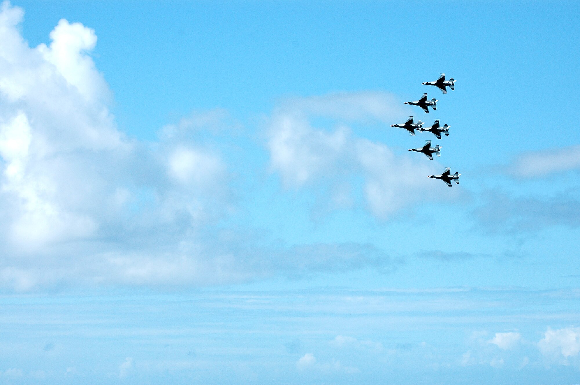 Thunderbirds members fly over Waikiki Beach during a practice demonstration, Sept. 13. The Air Demonstration Squadron, performs aerial maneuvers to exhibit the capabilities of modern high performance aircraft, as well as the professional skill required to operate them, Photo by 2nd Lt. Melanie McLean.