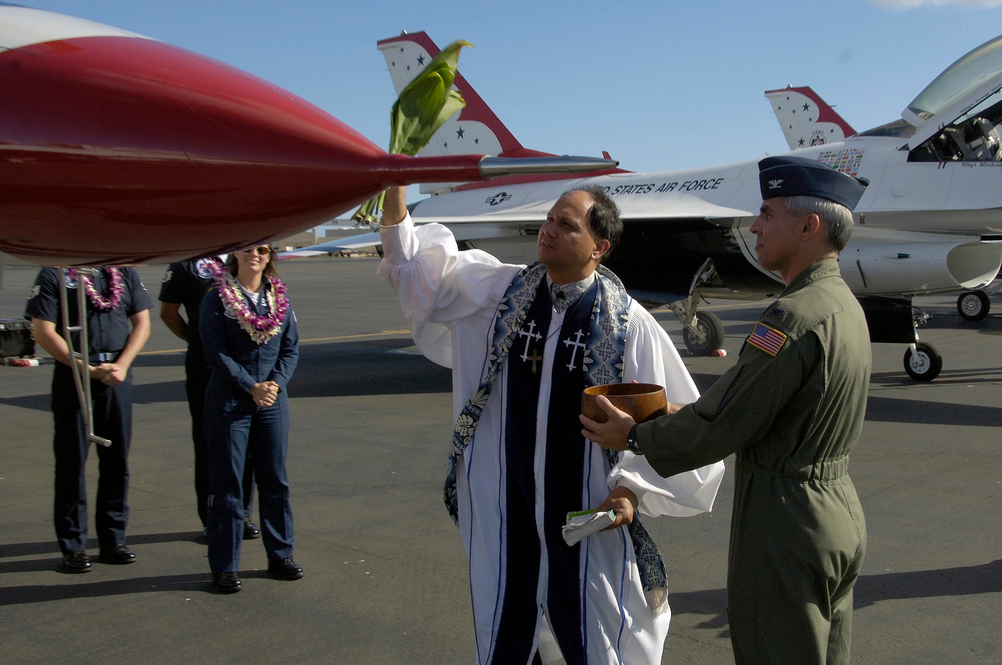HICKAM AIR FORCE BASE, Hawaii -- Kahu (Priest) Kekoa accompanied by Colonel John J. Torres (right), Commander, 15th Air Wing, give a traditional Hawaiian blessing to the U.S. Air Force Air Demonstration Squadron Thunderbirds upon their arrival at Hickam Air Force Base, Hawaii, on September 12, 2007. The Thunderbirds will be bringing the Air Force, its people and their capabilities to the residents of Hawaii during their air shows to commemorate the U.S. Air Force’s 60th Anniversary. (U.S. Air Force photo by Staff Sgt. Derrick C. Goode)