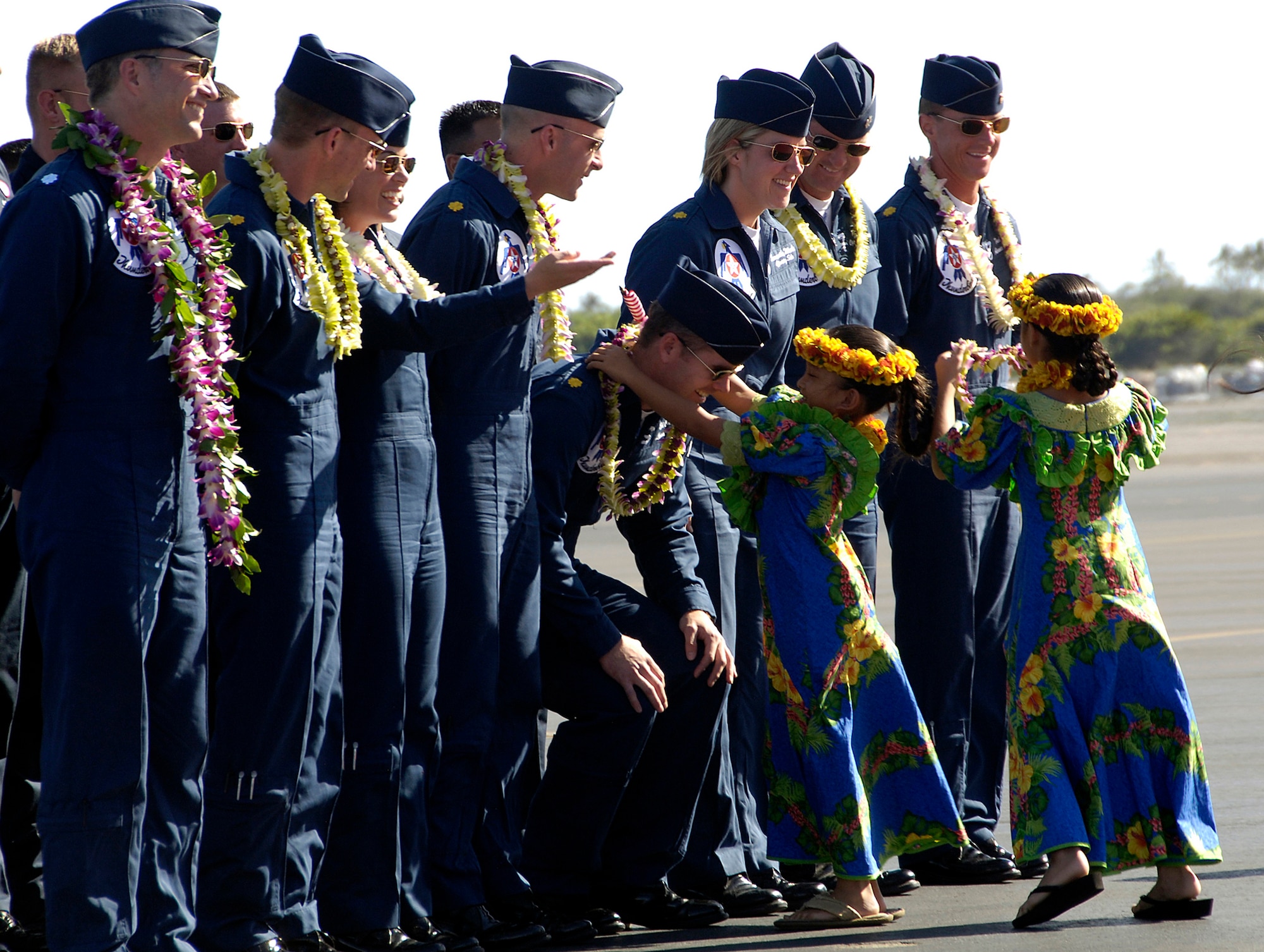 HICKAM AIR FORCE BASE, Hawaii -- The U.S. Air Force Air Demonstration Squadron Thunderbirds receive a traditional Hawaiian greeting upon arrival at Hickam Air Force Base, Hawaii, on September 12, 2007. The Thunderbirds will be bringing the Air Force, its people and their capabilities to the residents of Hawaii during their air shows to commemorate the U.S. Air Force’s 60th Anniversary. (U.S. Air Force photo by Staff Sgt. Derrick C. Goode)