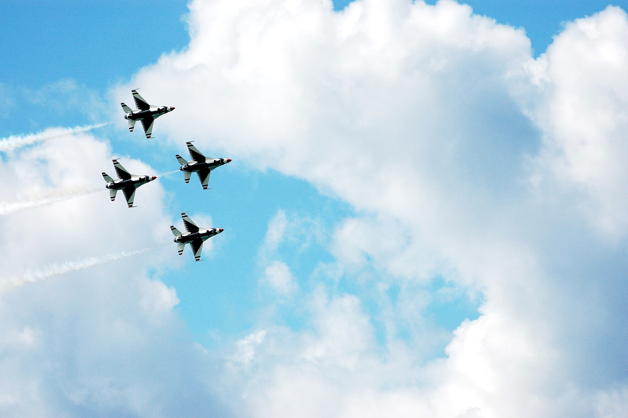 Thunderbirds members fly in a four-ship formation during a practice demonstration Sept. 13 over Waikiki Beach. The Air Demonstration Squadron, whose mission is to plan and present aerial maneuvers to exhibit the capabilities of modern high performance aircraft, and the high degree of professional skill required to operate those aircraft, will perform an airshow over Waikiki Beach, Sept. 15 at 2:30 p.m. Photo by 2nd Lt. Melanie McLean.  