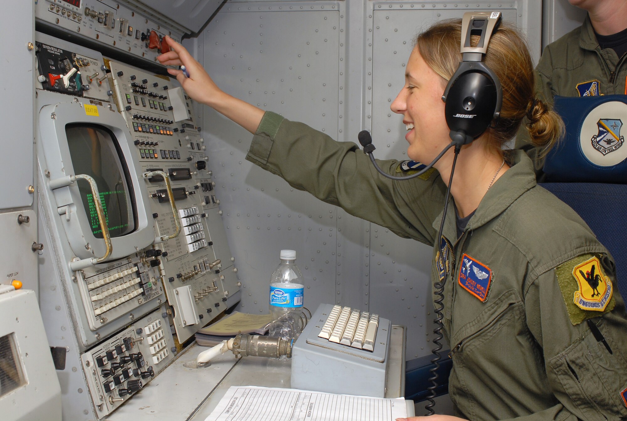 Senior Airman Ashley Newell documents any system malfunctions so that they can be trouble shot before the E-3 Airborne Warning and Control System's (AWACS) next flight at Kadena Air Base, Japan, Sept. 11, 2007.  The AWACS' primary mission is to provide surveillance, command and control and airborne management.  Airman Newell is from the 961st Airborne Air Control Squadron.  (U.S. Air Force photo/Airman 1st Class Kelly Timney)
