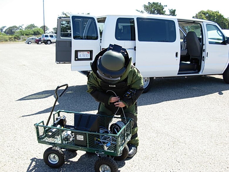 VANDENBERG AIR FORCE BASE, Calif.-- Member of vandenbergs explosive ordnance demolition team prepare to inspect a van during an exercise Sept. 12. The entire base participated in the exercise that tested its ability to react to a terrorist attack.(Air Force Photo courtesy of 30th Inspector General Office)       