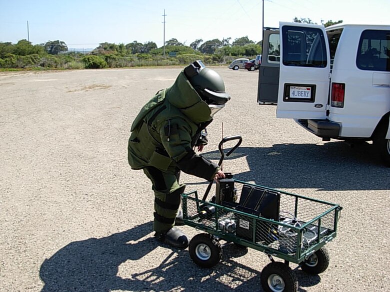 VANDENBERG AIR FORCE BASE, Calif.-- Member of vandenbergs explosive ordnance demolition team prepare to inspect a van during an exercise Sept. 12. The entire base participated in the exercise that tested its ability to react to a terrorist attack.(Air Force Photo courtesy of 30th Inspector General Office)    