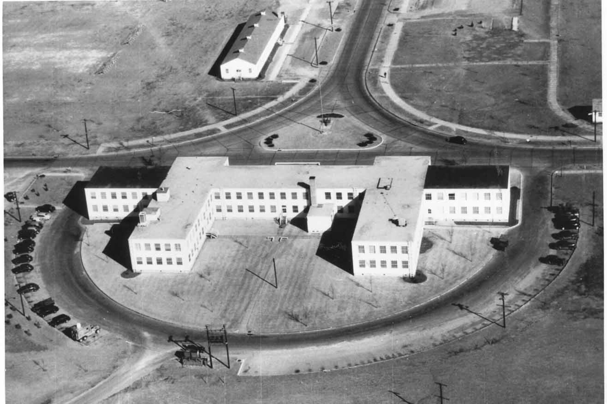 A view of Bldg. 460, Tinker's 72nd Air Base Wing headquarters building in the 1940s. Tinker Air Force Base was named Tinker Field on Oct. 14, 1942, approximately four months after Gen. Tinker was killed in an air battle. The building faces Arnold Avenue and a would-be Eaker Gate. (Air Force photo courtesy of Oklahoma City Air Logistics Center History Office)