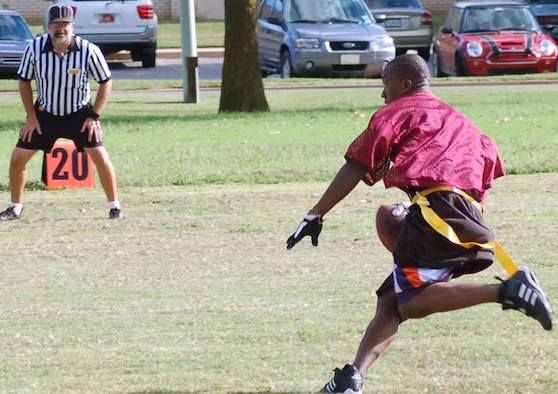 VQ-3 running back Mack McIntyre races down field during intramural football action Sept. 5. The 960th AACS won the season opener 14-0. (Air Force photo by John E. Banks)