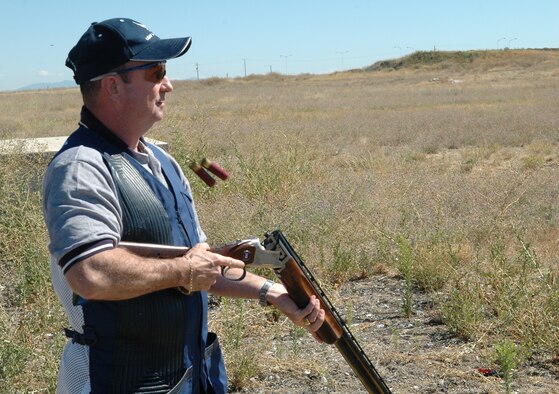 FAIRCHILD AIR FORCE BASE, Wash. -- Master Sgt. Dale Brunelle, 92nd Aircraft Maintenance Squadron section chief, empties the spent cartridges out of his competition shotgun while practicing at the sports range here. While on the practice range, Sergeant Brunelle makes every shot count in his quest to regain the title of best shooter in the Air Force. (U.S. Air Force photo / Tech. Sgt. Larry W. Carpenter Jr.)