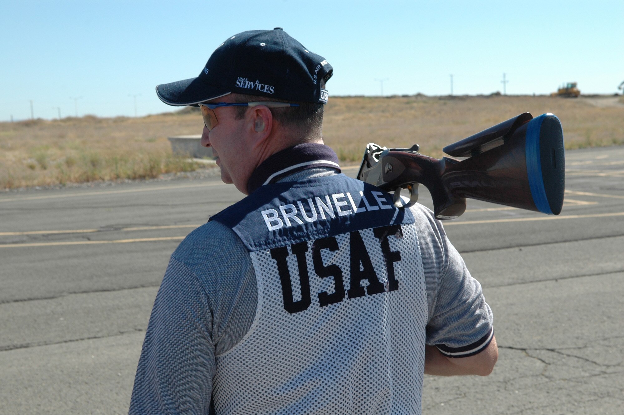 FAIRCHILD AIR FORCE BASE, Wash. -- Master Sgt. Dale Brunelle, 92nd Aircraft Maintenance Squadron section chief, strolls over to the skeet range at the outdoor sports range here to get in some practice shots. Sergeant Brunelle is a member of the United States Air Force shooting team and is getting back into the sport after spending four years in Okinawa. (U.S. Air Force photo / Tech. Sgt. Larry W. Carpenter Jr.)