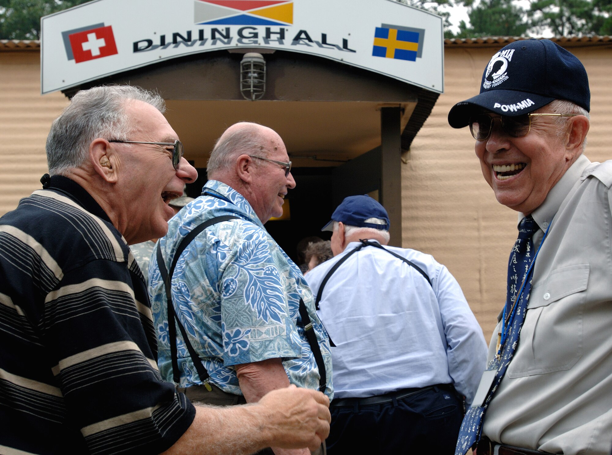 Just like old times, Donald Krueger (left) shares stories and cracks jokes while in a line for the dinning hall with retired Lt. Col. Harold Fischer during a Sept. 13 tour held to honor Korean War veterans in Panmunjeom, South Korea. Colonel Fischer is a double ace fighter pilot from the war. Mr. Krueger was an enlisted munitions specialist during the Korean War. The two had not seen each other in 55 years. The joint security area is the only place where North and South Korea connect. Air Force Korean War veterans are visiting South Korea during a weeklong tour in observance of the Air Force's 60th Anniversary. (U.S. Air Force photo/Staff Sgt. Bennie J. Davis III) 
