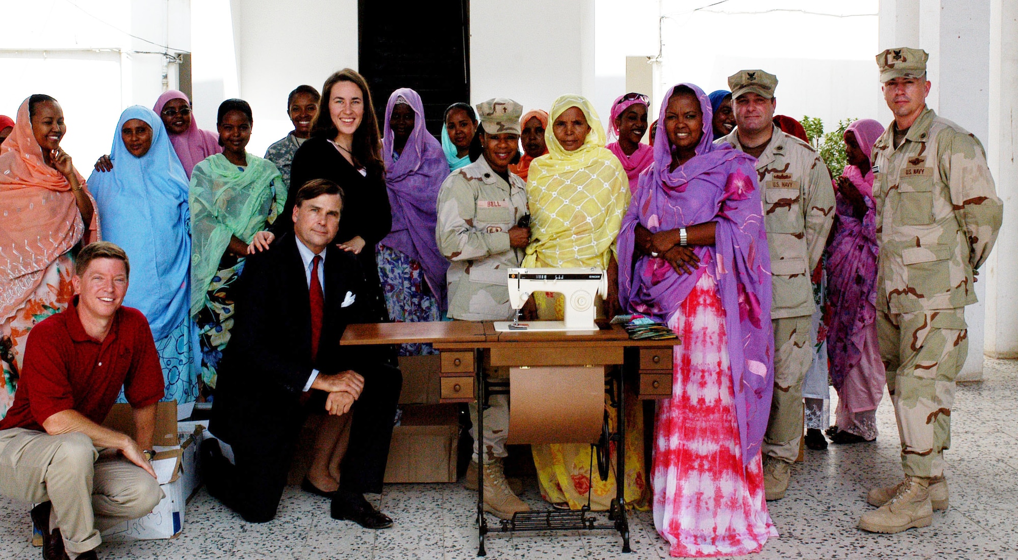 Navy Cmdr. Joel Weaver, W. Stuart Symington and his daughter, Janey, Chaplain (Lt. Col.) Oledia Bell, and Petty Officers 1st Class Jason Bocchino, and Wayne George deliver a donation to the students and teachers of the Union National of the Djibouti Women Sept. 7 in Djibouti. Commander Weaver is the officer in charge of the Country Coordination Element - Djibouti and Mr. Symington is the U.S. ambassador to Djibouti. The donation was part of Operation Hand Clasp and included a sewing machine, sewing materials, and pens and notebooks. The Union National of the Djibouti Women provides job skills training to Djiboutian women. Members of the Combined Joint Task Force - Horn of Africa Chaplain's office delivered the donation. (U.S. Navy photo/Petty Officer 1st Class John Osborne) 
