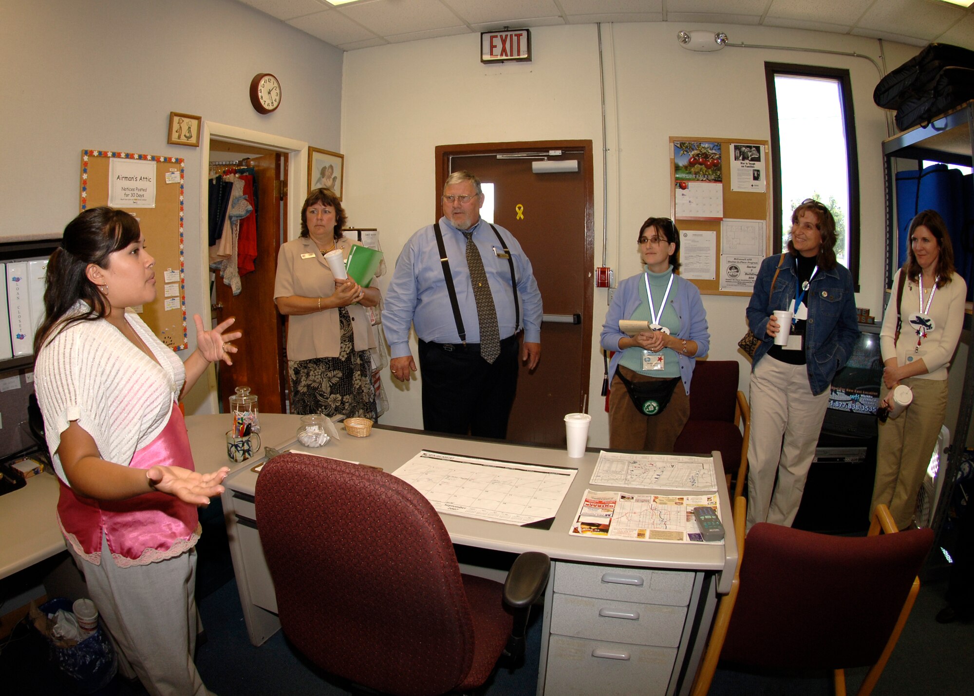 Lorraine Ditch, coordinator for the Airman’s Attic, gives a brief tour and description of the facility to the Spouses of McConnell group, Sept 11. Mrs. Ditch explained how the Airman’s Attic is designed to reduce the cost of household items for junior enlisted members by providing them at no cost to military of the rank of senior airman and below and below. (Photo by Airman 1st Class Laura Suttles)
