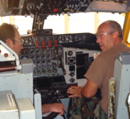 Craig Wiggins and Tech Sgt. Joe Hanson ensure the KC-135 flight deck is fit to fly and meets all quality inspection requirements. (Air Force photo)