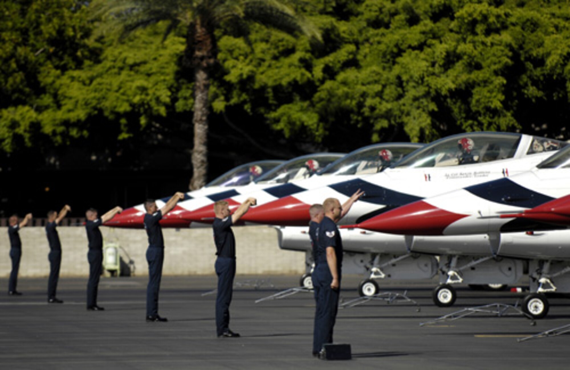 HICKAM AIR FORCE BASE, Hawaii -- Thunderbird maintainers marshal their jets to their parking spots during an arrival ceremony here Sept. 12. The Thunderbirds will be performing as part of Air Force Week Honolulu. (U.S. Air Force photo/Tech. Sgt. Shane A. Cuomo)