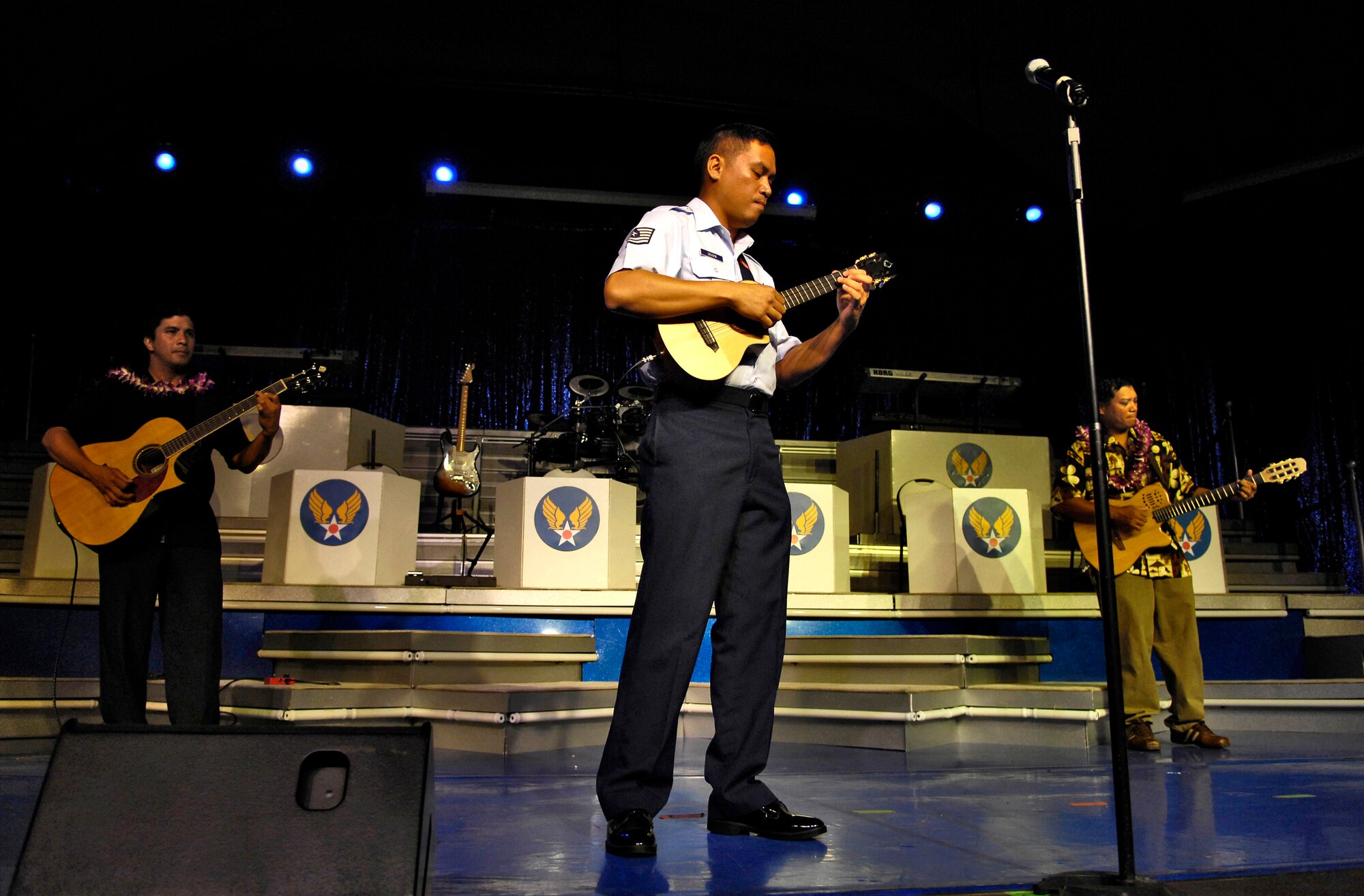 Tech. Sgt. Daniel Baduria plays his ukulele as the opening act for Tops In Blue Sept. 12 at the Waikiki Shell in Honolulu. He inherited his music talent from his father, Donald Baduria, who was an Airman with the Strolling Strings Trio in the Air Force's Tops In Blue entertainment showcase in the 1950s. Sergeant Badura played as part of the Heritage to Horizons theme of the Air Force's 60th anniversary. Tops In Blue, the Air Force's signature entertainment group, gave a free performance for the public to celebrate Air Force Week Honolulu and the Air Force's 60th anniversary. Sergeant Baduria is an aircraft fuel systems specialist with the Hawaii Air National Guard's 154th Wing. (U.S. Air Force photo/Tech. Sgt. Shane A. Cuomo) 