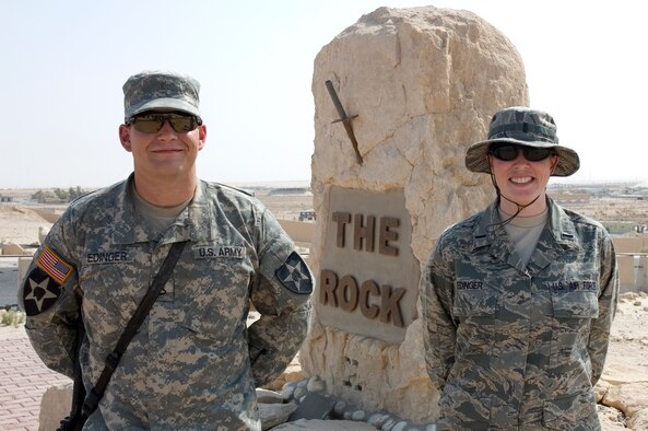 SOUTHWEST ASIA -- 1st Lt. Sunni Edinger and her son, Private First Class Stefan Edinger, pose for a photograph after reuniting in September 2007 in Southwest Asia.  PFC Edinger who is stationed at Fort Lewis, WA., was in transit from Iraq through the 368th Air Expenditionary Wing where his mother, Lt. Edinger is deployed and is also currently stationed at Eielson AFB, AK.  (U.S. Air Force photo by Staff Sgt. Tia Schroeder)