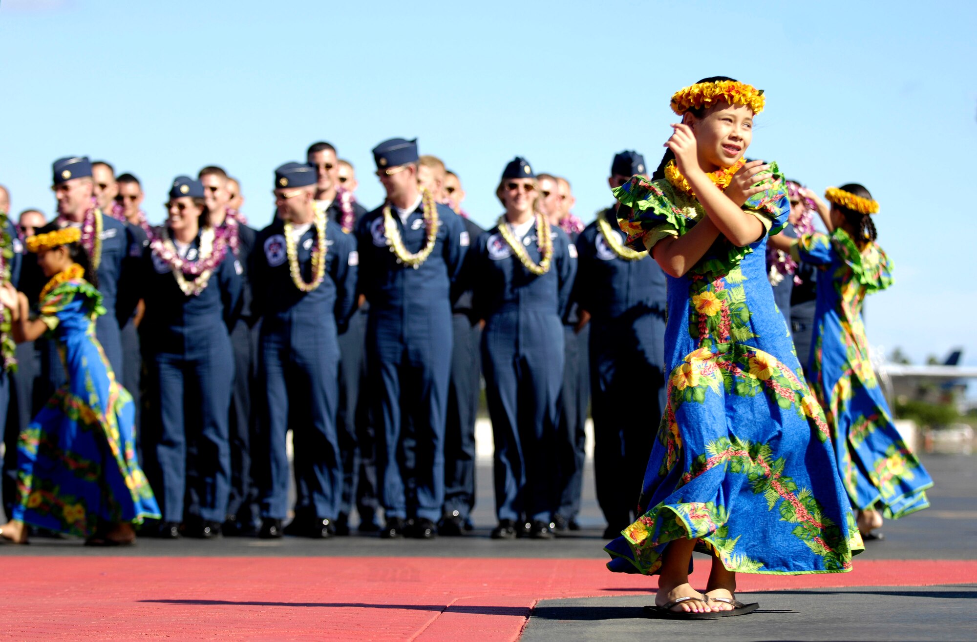 Members of the Air Force Air Demonstration Squadron, the Thunderbirds, are welcomed to Hickam Air Force Base, Hawaii, Sept. 12. The team is performing as part of Air Force Week Honolulu, which runs Sept. 8 through 15. (U.S. Air Force photo/Tech. Sgt. Shane A. Cuomo) 
