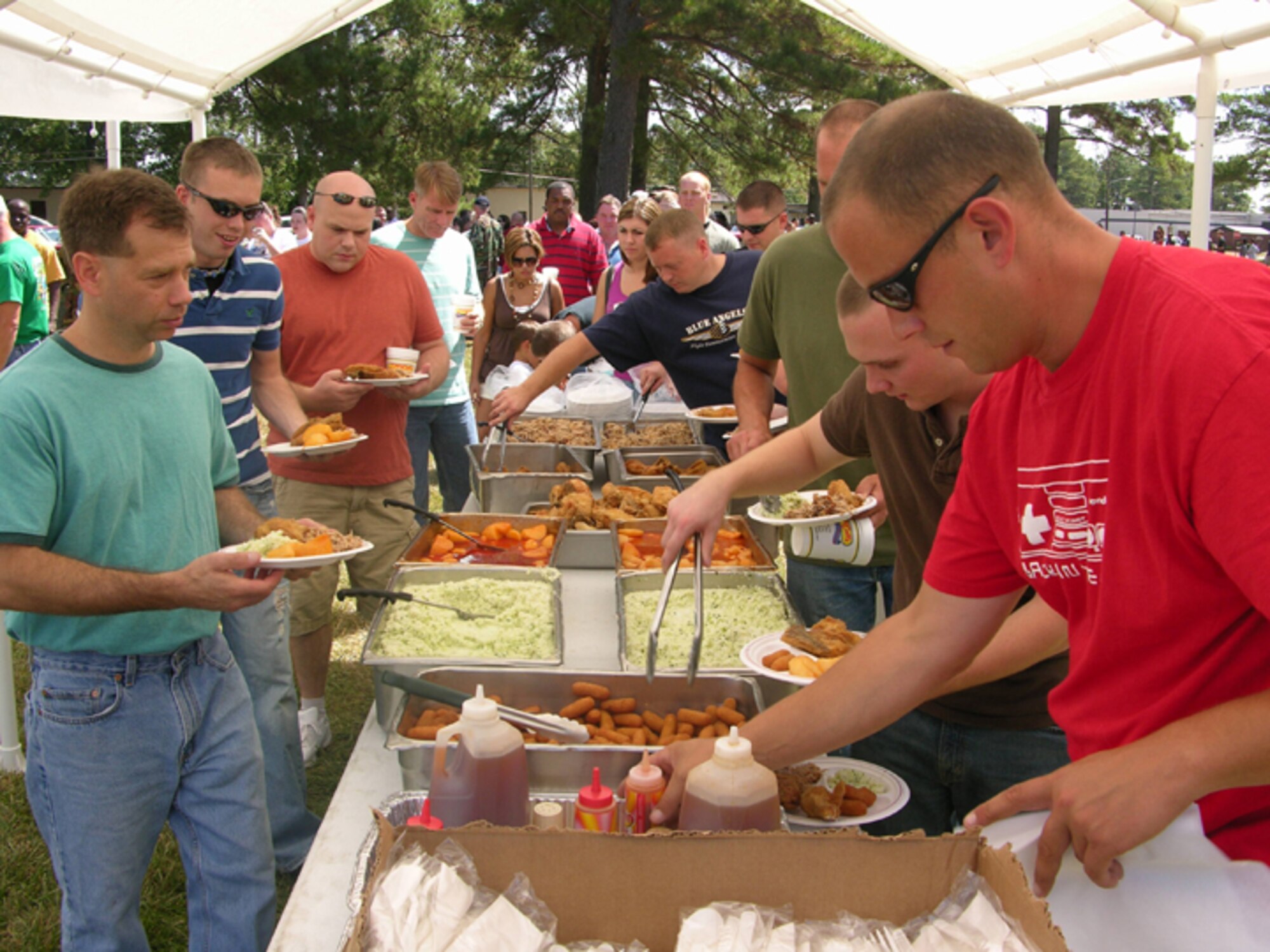 SEYMOUR JOHNSON AIR FORCE BASE, N.C.--Food, food and more food.  Members of the 916th Air Refueling Wing, Air Force Reserve, enjoy food catered bya local restaurant during the family day picnic held at the September unit training assembly.