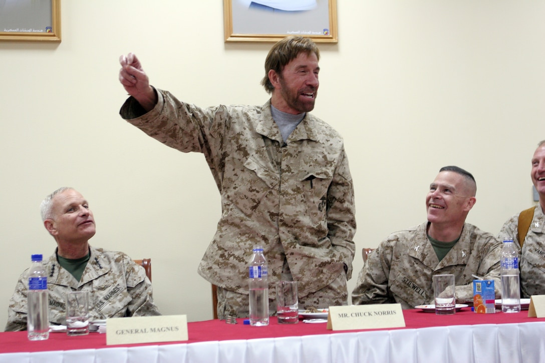 Honorary Marine Chuck Norris sets the record straight about some myths that have been circulating about the martial arts legend (no, he doesn't have another fist behind his beard) during a dinner at Camp Buehring, Kuwait, for a select group of Marines from the 22nd Marine Expeditionary Unit (Special Operations Capable), Sept 13, 2007. The 22nd MEU(SOC) is in Kuwait conducting sustainment training as part of a scheduled deployment.