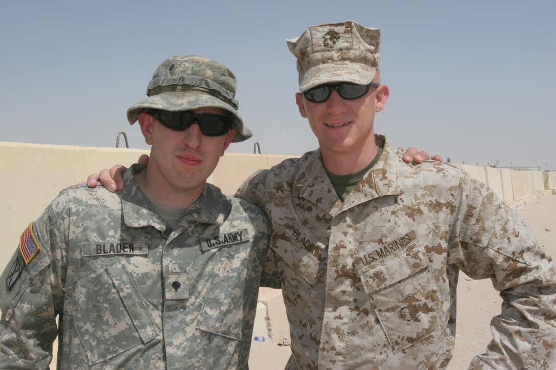 Brothers, 2nd Lt. Shane A. Bladen (right), of Vicksburg, Va., an air support officer with Marine Medium Helicopter Squadron 261 (Reinforced), 22nd Marine Expeditionary Unit (Special Operations Capable) and Spec. Seth A. Bladen, a fuel supply technician with 1st Brigade Combat Team, 1st Brigade Special Troops Battalion, 10th Mountain Division, pose for a quick snapshot after crossing paths aboard Camp Buehring, Kuwait, Sept. 14, 2007.