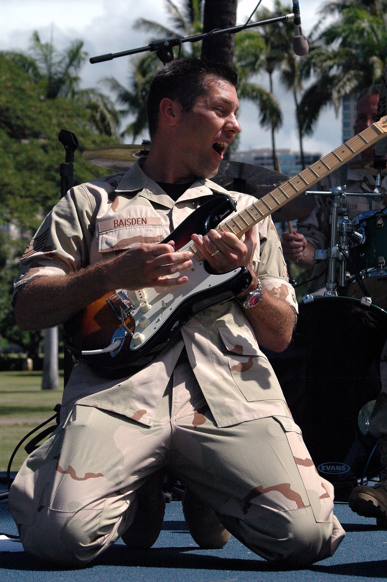 FORT DERUSSY, Hawaii -- Technical Sgt. Richard Baisden, United States Air Force Band of the Pacific Top Cover, plays his guitar solo for the crowd Sept. 13 at Fort DeRussy. The band not only performed at Fort DeRussy several times but also played at Kahala Mall and at the 9-11 Remembrance Ceremony. (U.S. Air Force Photo by Tech. Sgt. Bryan Gatewood)