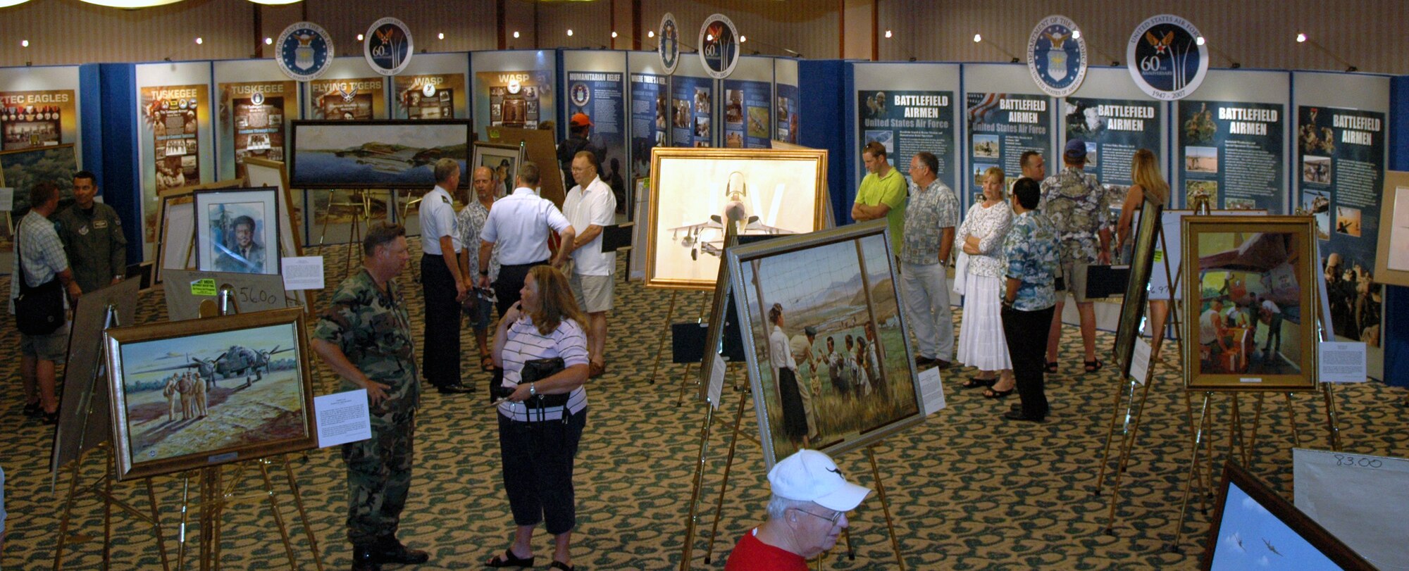 WAIKIKI -- Visitors view nearly 60 paintings at the "Heritage to Horizons" art exhibit Sept. 13 at the Hale Koa Hotel. The United States Air Force Art Collection documents the story of the Air Force through the universal language of art. (U.S. Air Force photo by Tech. Sgt Bryan Gatewood)