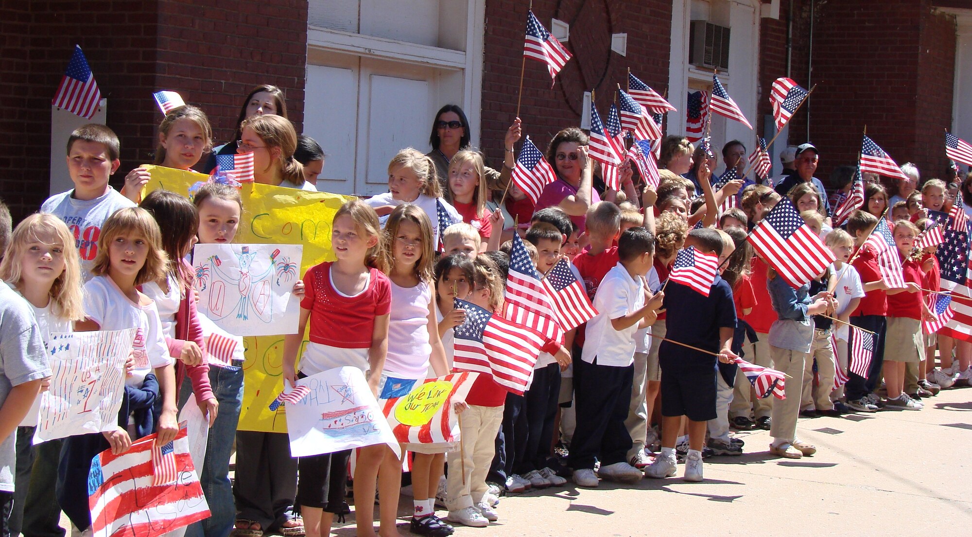 Some of El Reno, Okla.'s youngest residents turned out Tuesday to welcome more than 80 Team Vance members who joined other military and family members from Tinker AFB and Ft. Sill for a historic trip on the Union Pacific "Oklahoma Centennial Sooner Rocket" in celebration of the Oklahoma Centennial and in remembrance of Sept. 11, 2001.   Other scheduled stops included Hennessey and Kingfisher, where town officials and community members turned out to welcome the train and its special passengers.  Steam Engine 844 was the last of the steam locomotives built for the Union Pacific Railroad in 1944 and weighs more than 1,000,000 pounds.  It was the first time in more than 50 years that a steam engine operated on the Rock Island railroad tracks. (US Air Force photo/Nancy Farrell)

